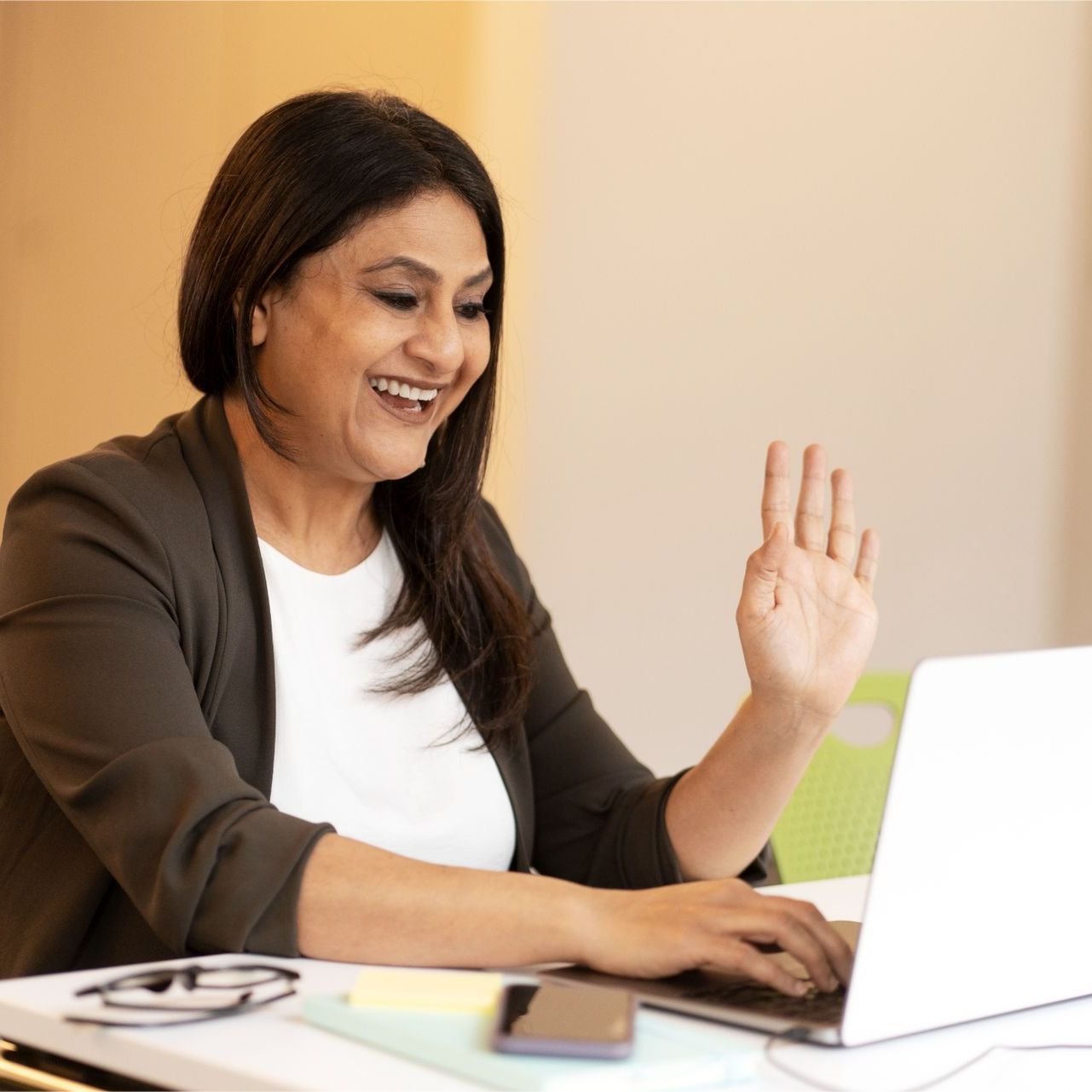 A woman is writing on a clipboard while a man wearing a mask looks on.