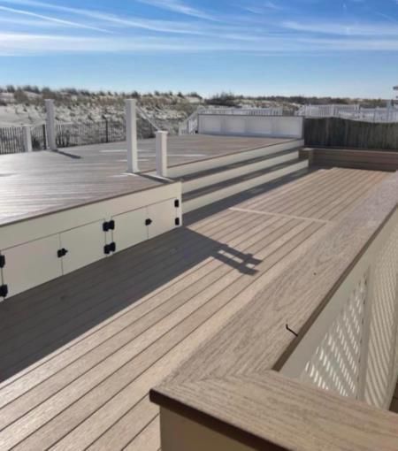 A wooden deck with stairs leading up to it.