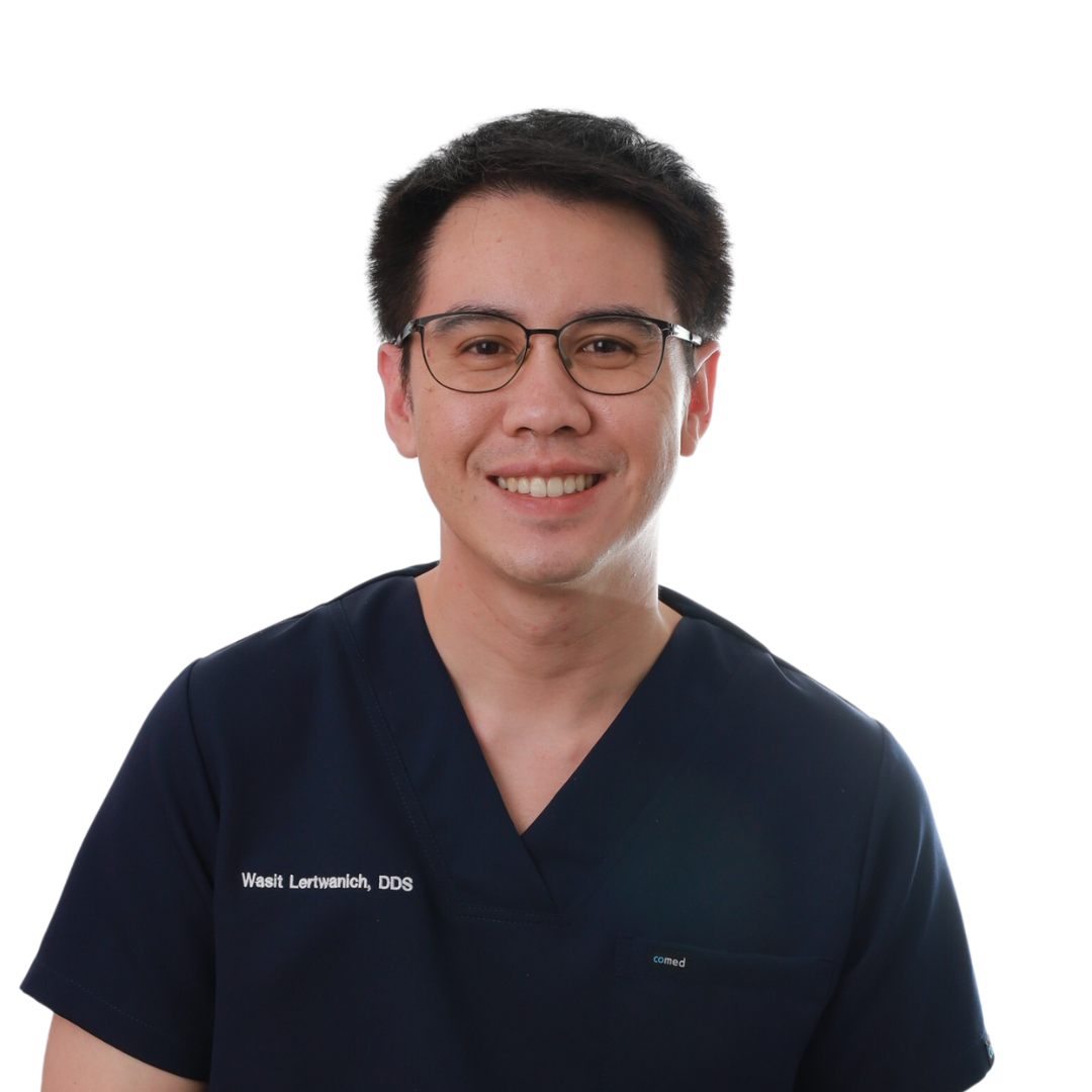 A smiling man in glasses and scrubs, against a white background.
