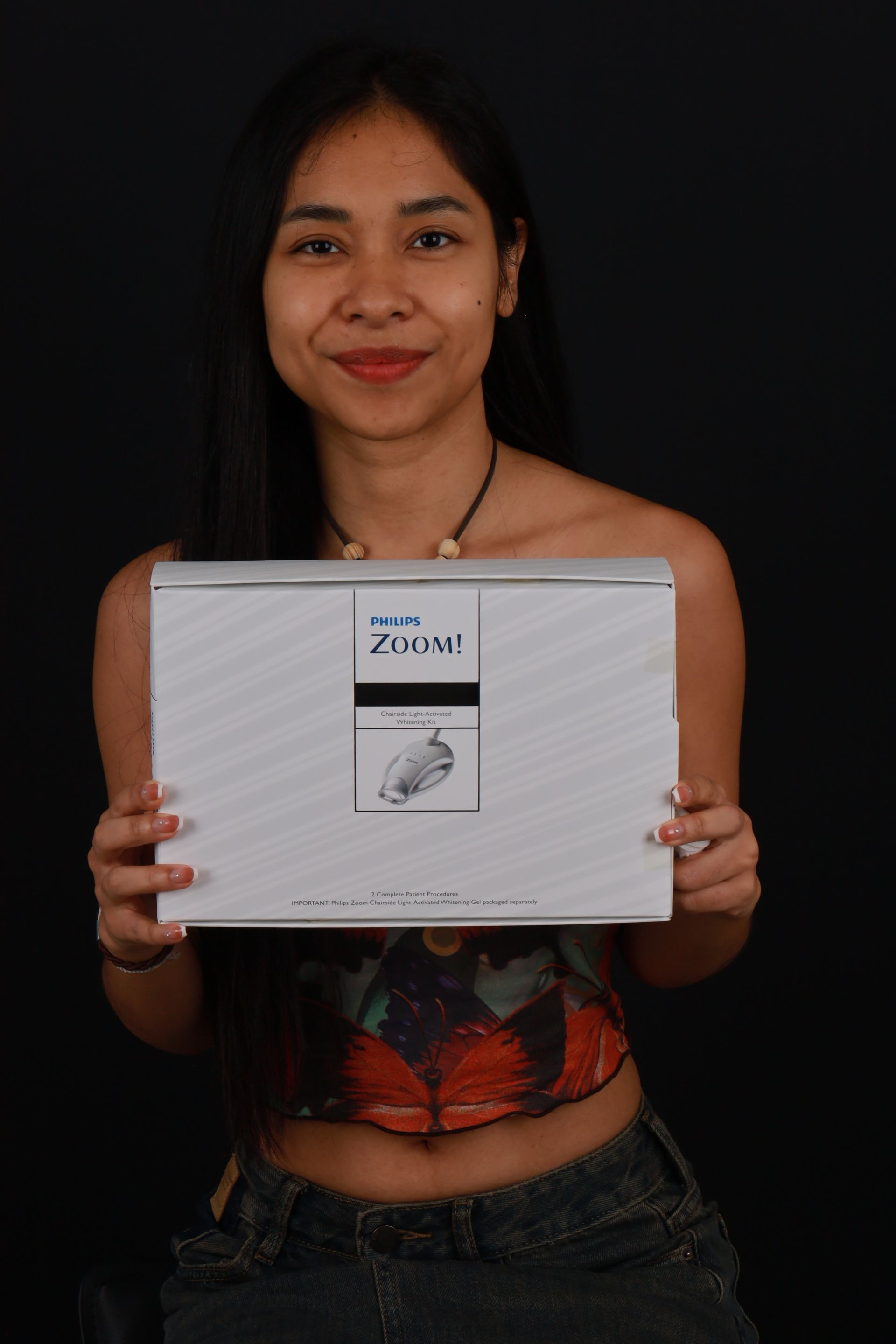 Woman holding a white box with 