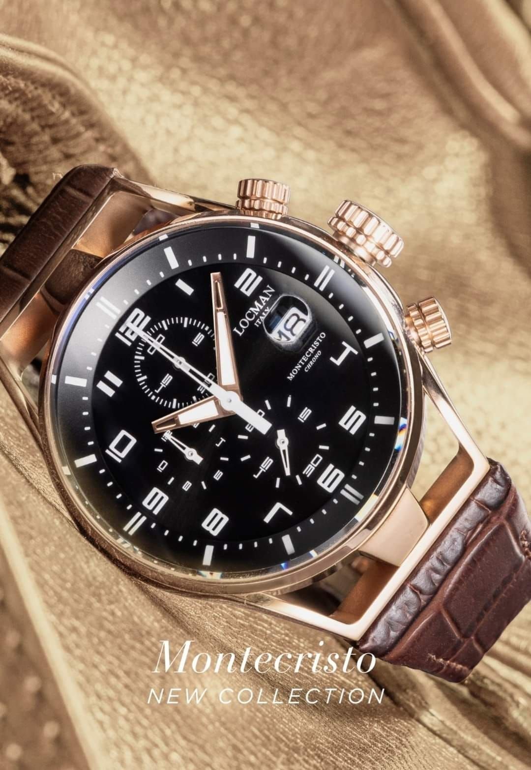 Orologio da polso in oro rosa con quadrante nero, cinturino marrone e scritta