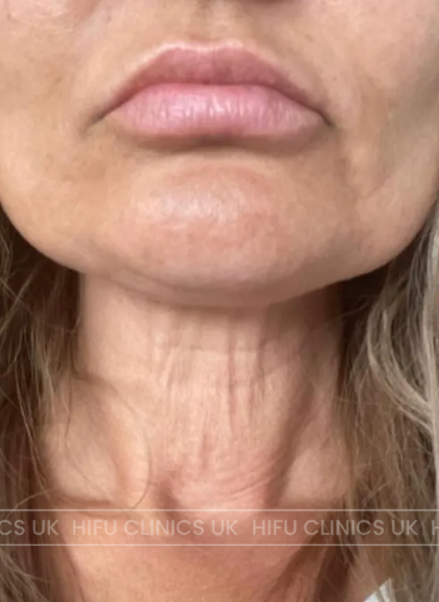 A close up of a woman 's face with red hair and earrings.