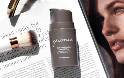 A bottle of epionce body shield lotion next to a magazine