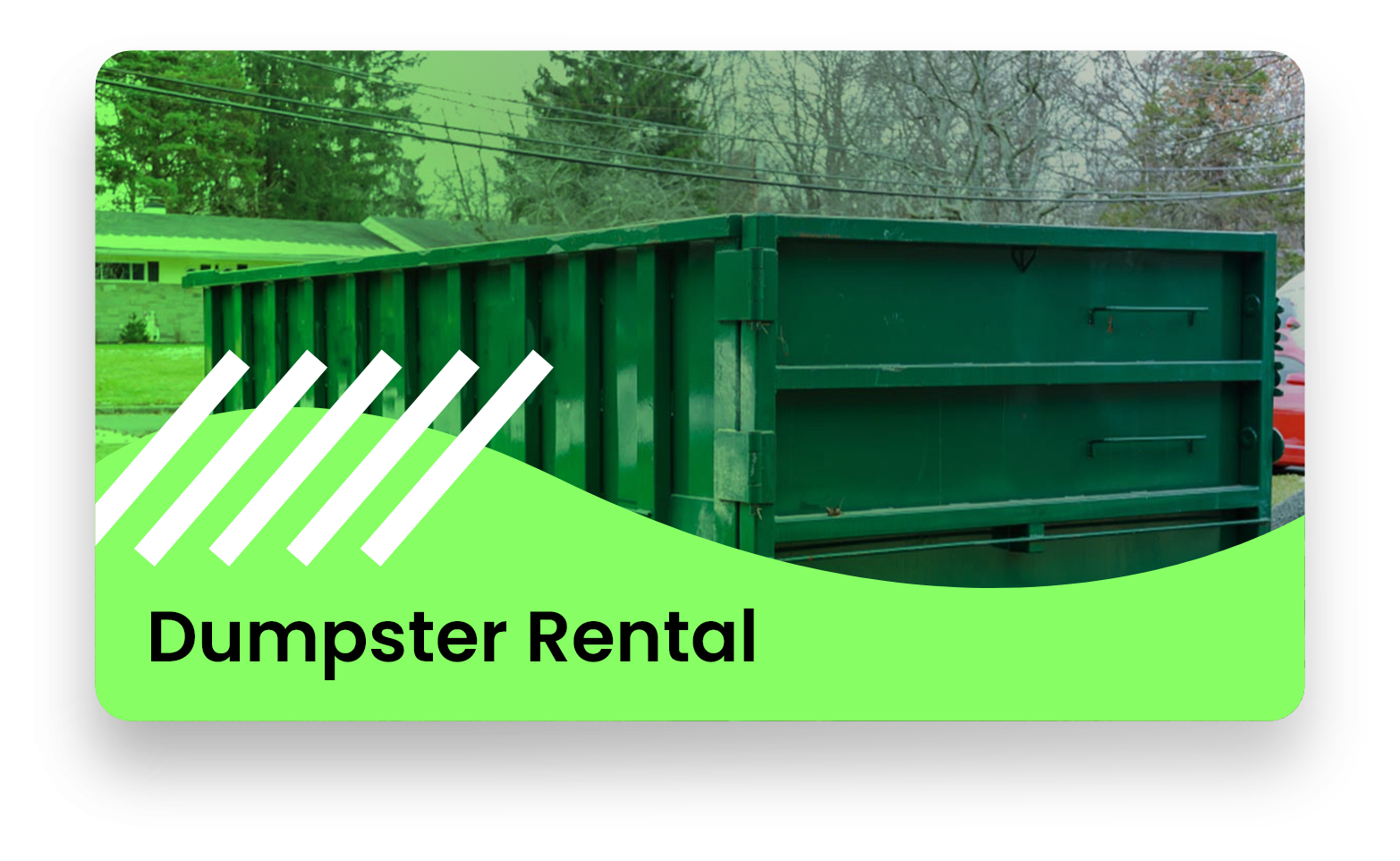 A green dumpster is sitting on top of a green hill.