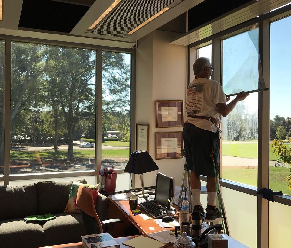 Man Installing a Tinted Window Film — Greenville, SC — iTint