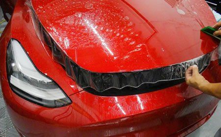 Worker Installing a Paint Protection — Greenville, SC — iTint