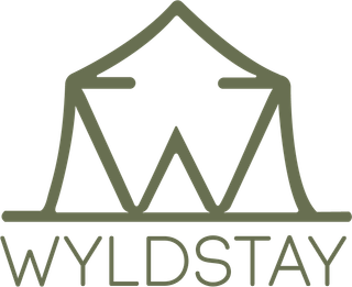 A logo for a company called wyldstay with a tent in the middle.