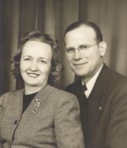 A close up of a bunch of flowers with a dark background.