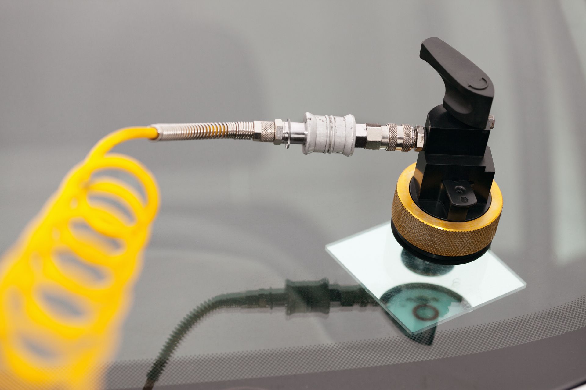 A close-up of a tool on a car windshield - Drummond, MT - Big Sky Auto Glass and Screens