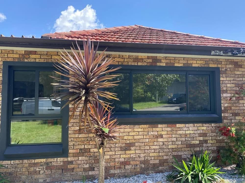 Brick House With Black-framed Windows — Ingrams Installations in Temora, NSW