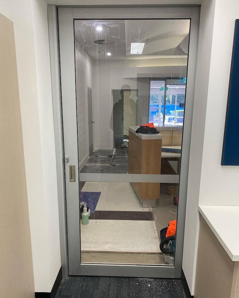Sliding Glass Door in an Office — Ingrams Installations in Temora, NSW