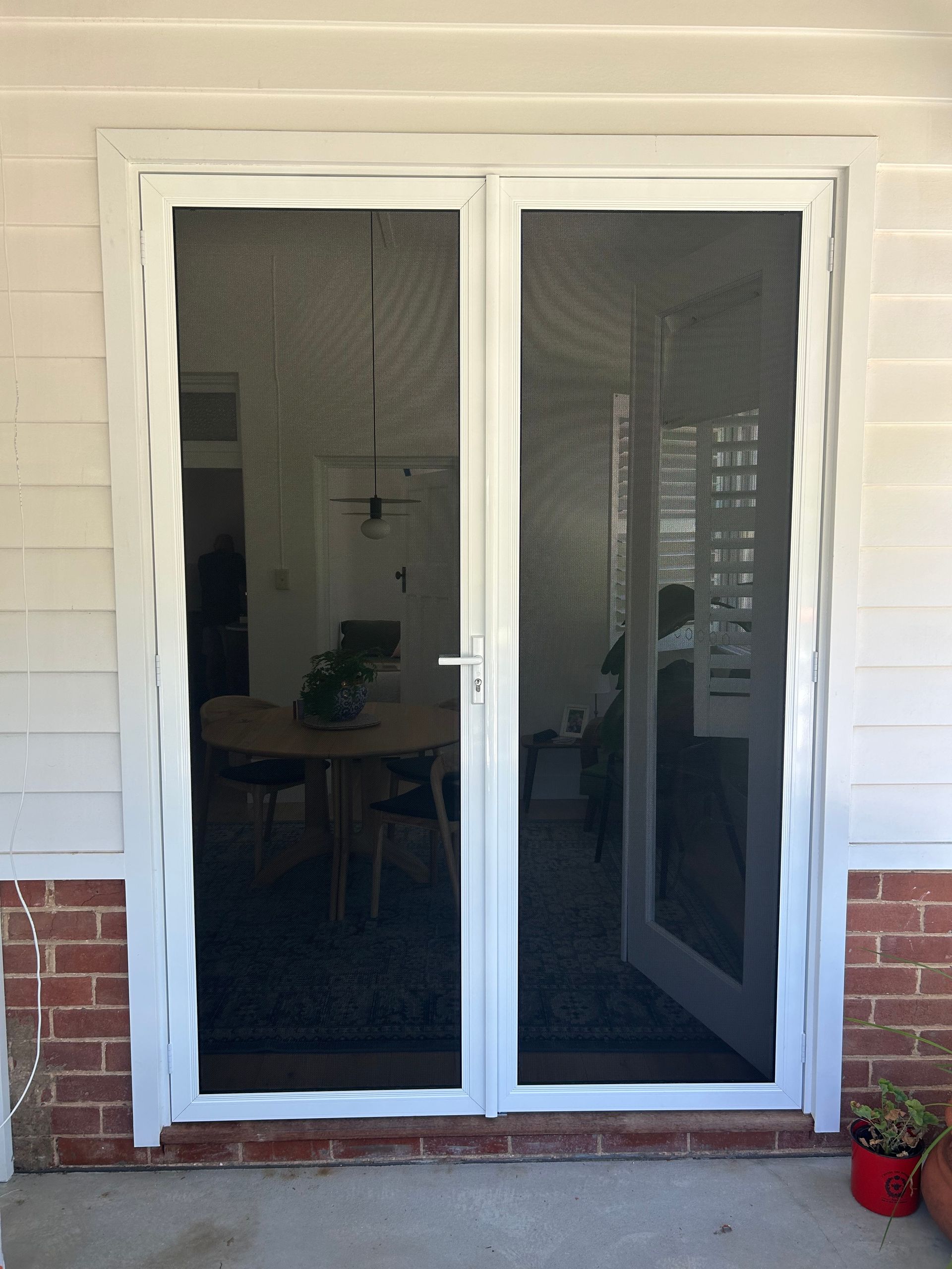 Screen Door next to Brick Wall — Ingrams Installations in Wagga Wagga, NSW