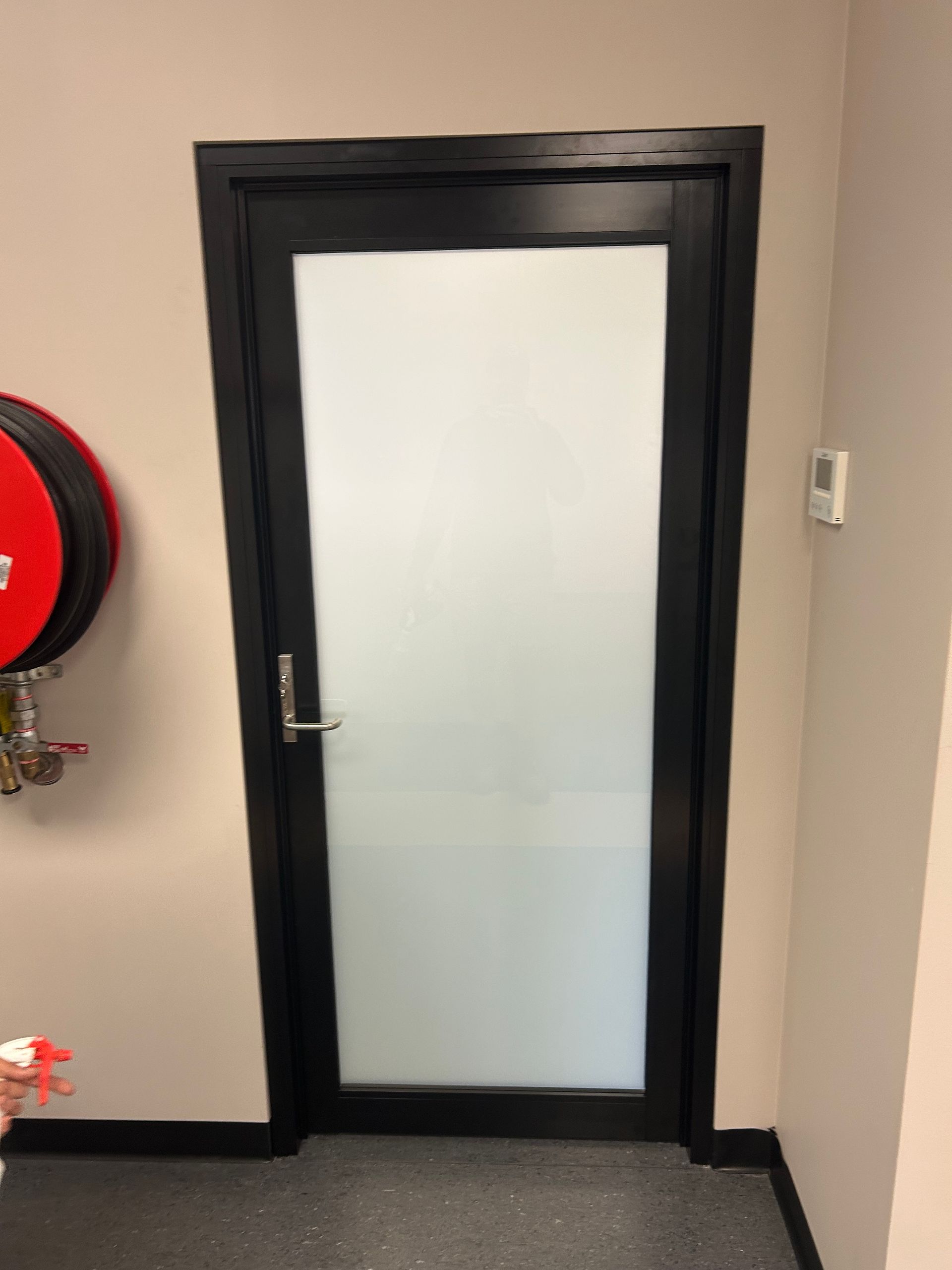 Aluminium Door With Black Framing — Ingrams Installations in Wagga Wagga, NSW