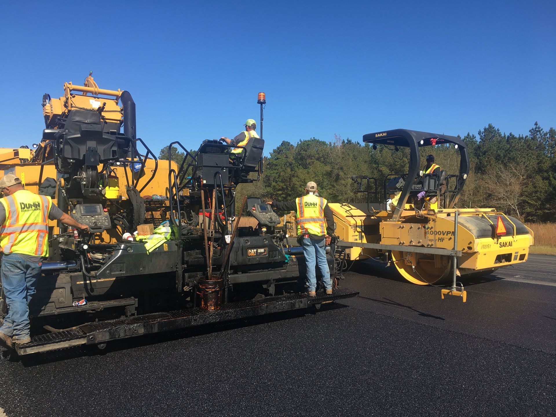 A picture of a mountain with a sun in the background.