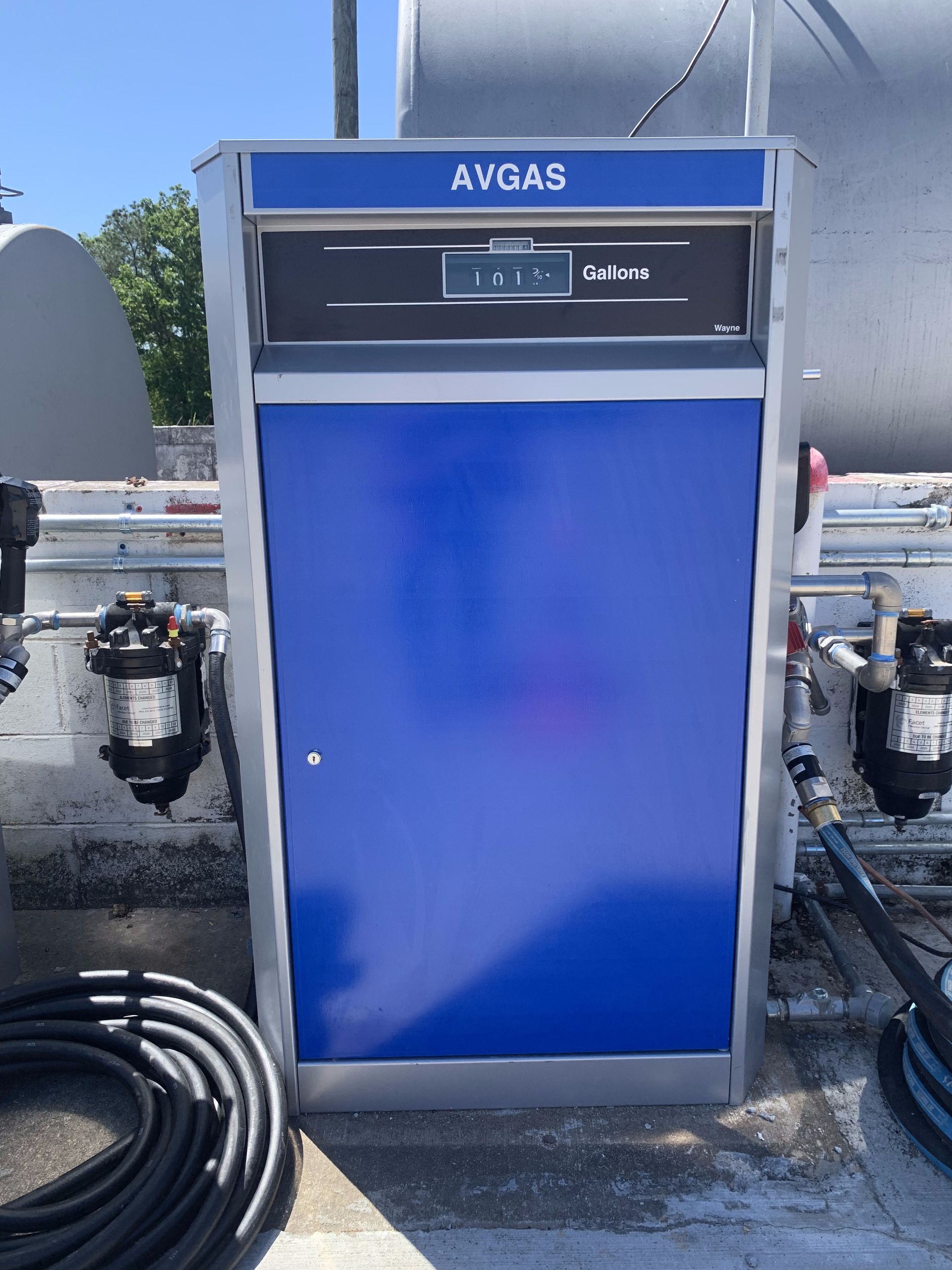 A picture of a mountain with a sun in the background.