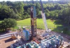 An aerial view of a construction site with a large crane.