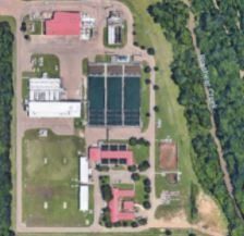 An aerial view of a residential area with lots of buildings and trees