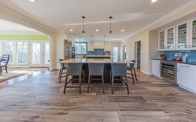 There is a large island in the middle of the kitchen.