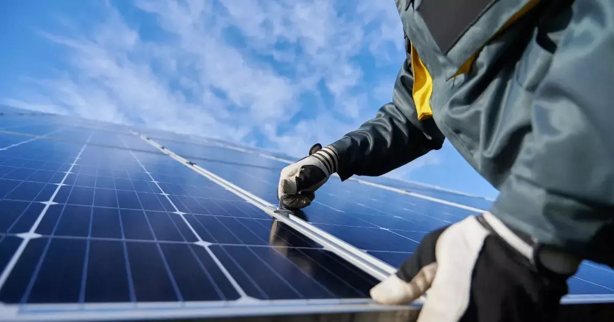 A professional installer securing solar panels for basement use to provide reliable energy for below-ground spaces