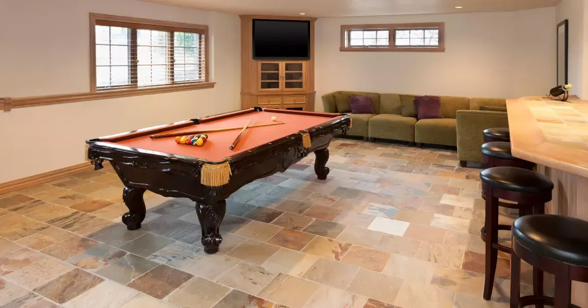 Basement game room with pool table and bar stools
