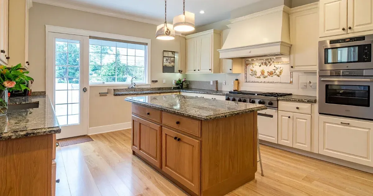 Bright traditional kitchen featuring granite countertops to customize kitchen island design