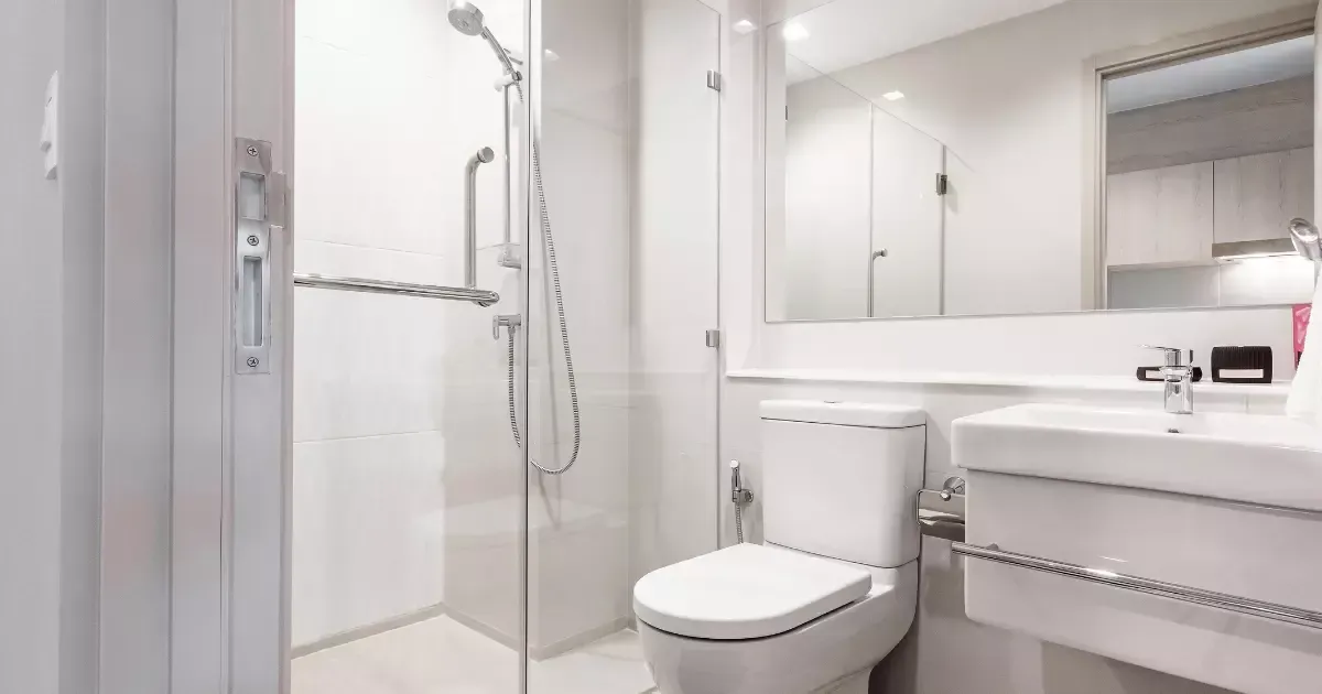 Compact basement bathroom with walk-in shower