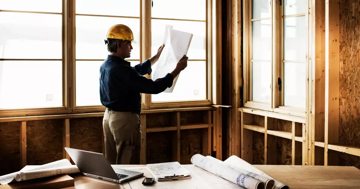 Construction Worker Reviewing Blueprints