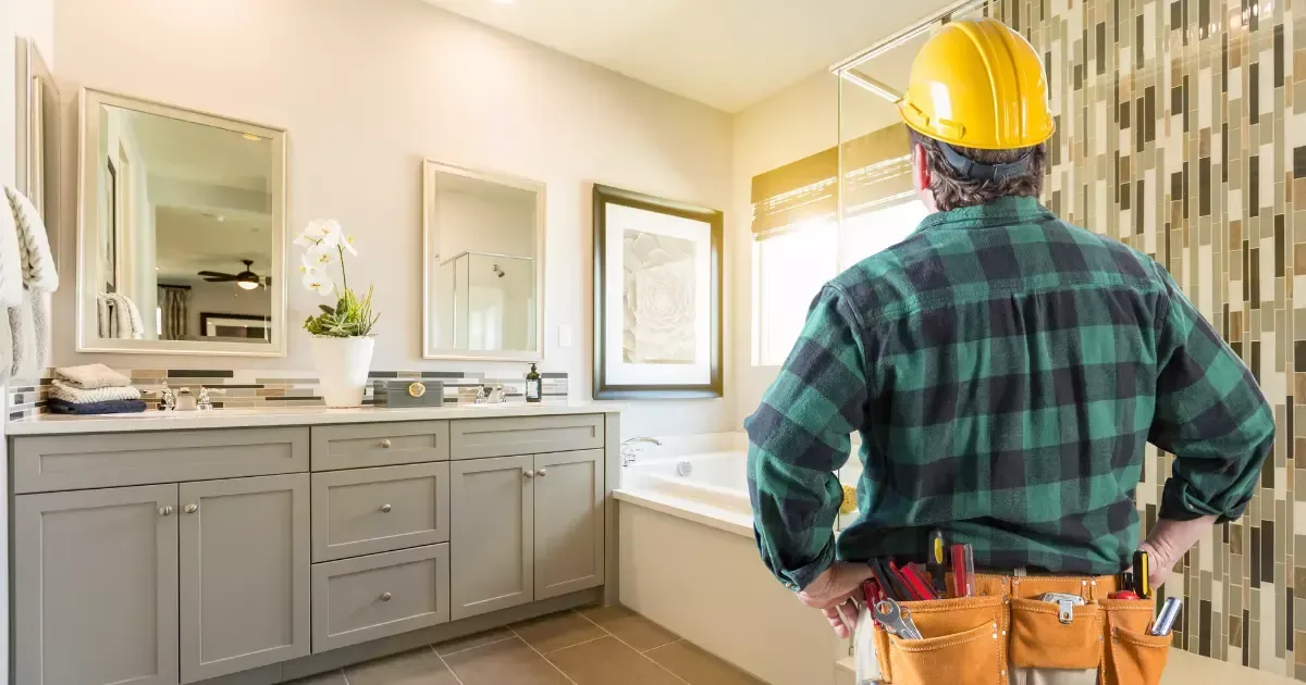 Contractor inspecting a modern bathroom remode