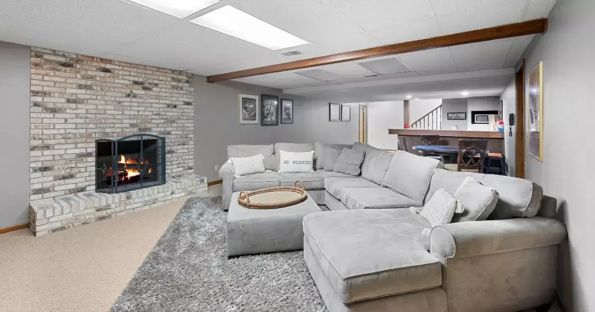 Cozy basement with fireplace and lounge, showing we do basements