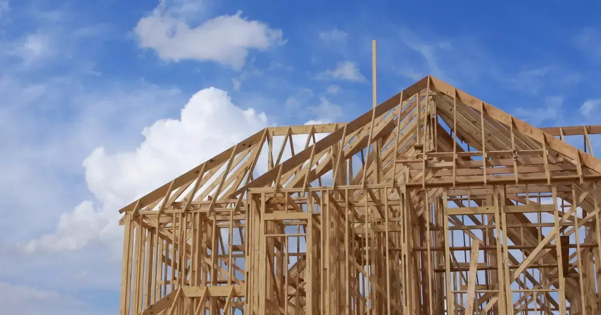 A wooden frame of a house under construction