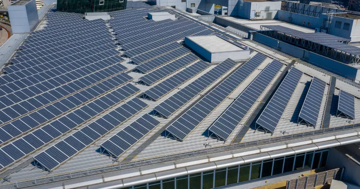 Extensive installation of commercial solar panels on an industrial building for clean energy production