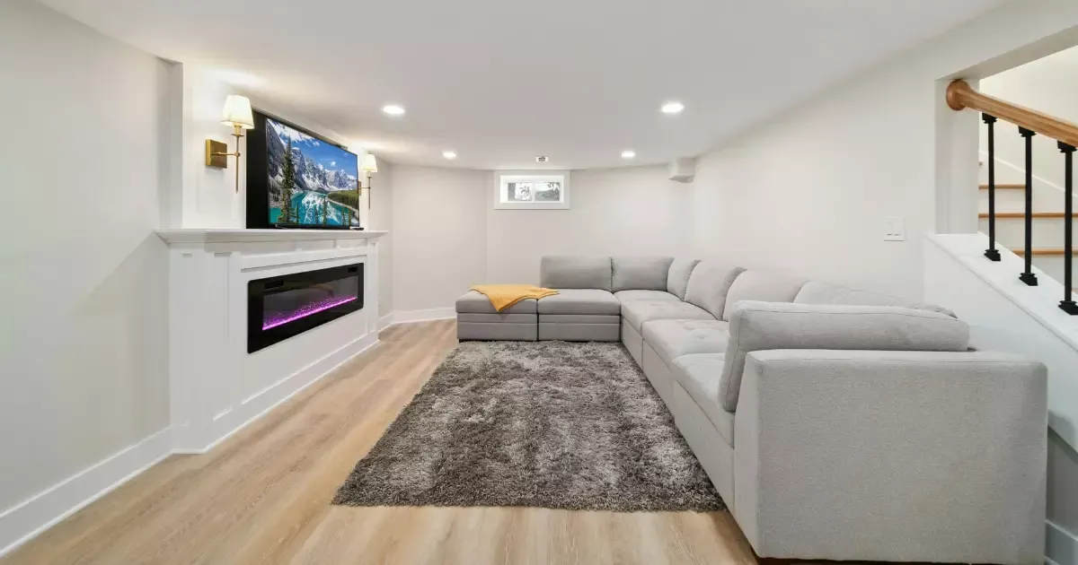 Finished basement with fireplace and TV