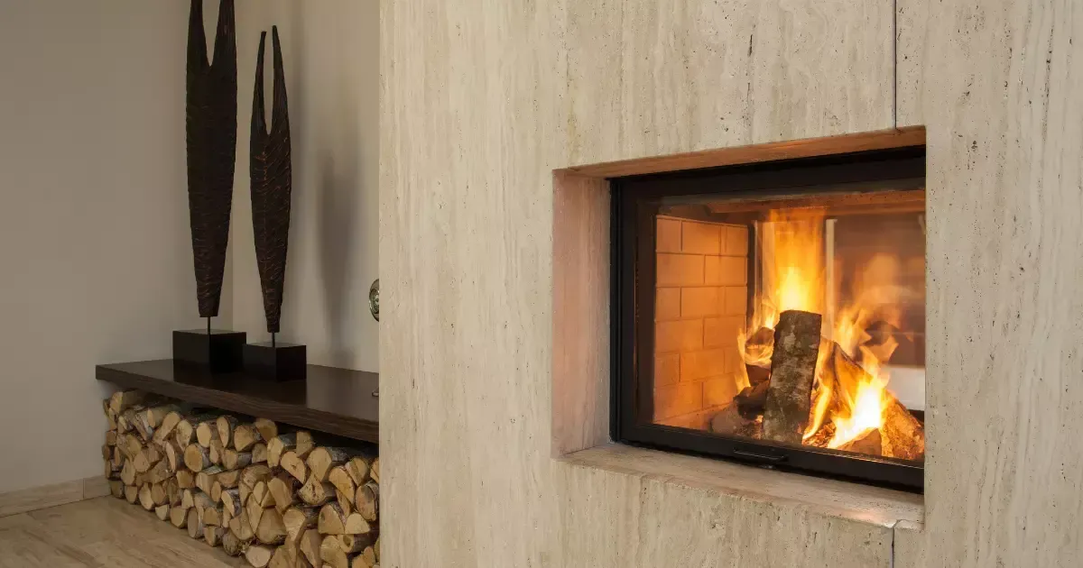 Firewood stacked beside a modern fireplace