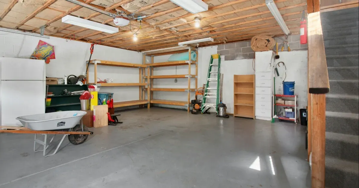 Garage remodel ideas featuring an organized garage layout with shelving, tools, and open floor space