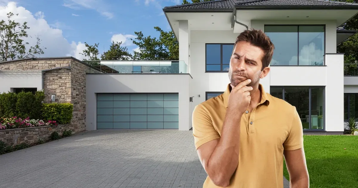 Homeowner considering property layout while comparing detached vs attached garage