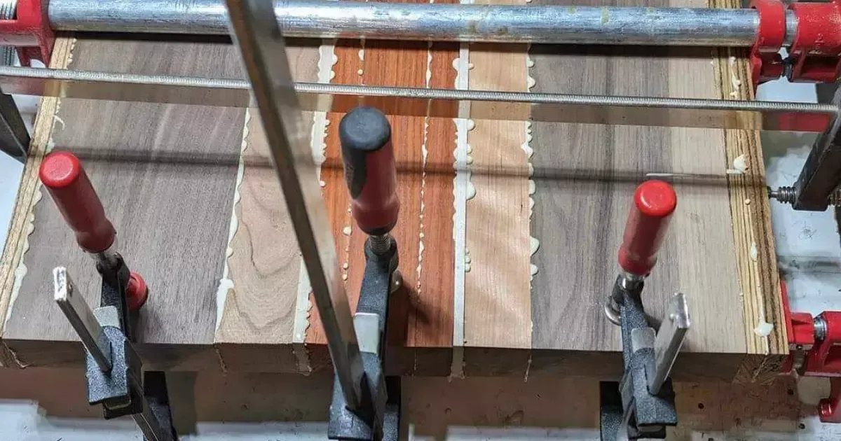 A wood plank with a metal bar