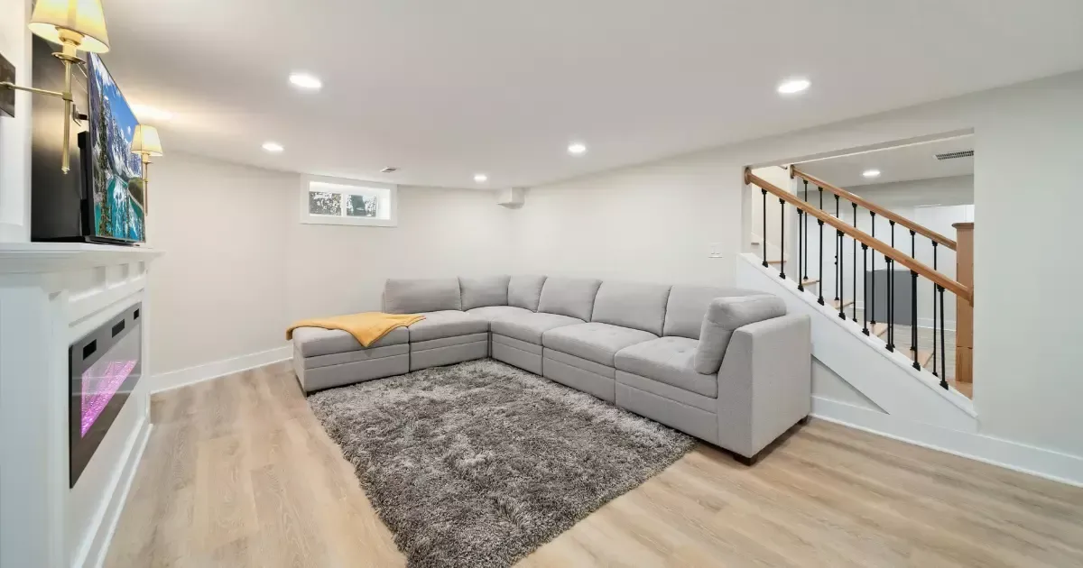 Modern living space with sectional sofa, showing we do basements