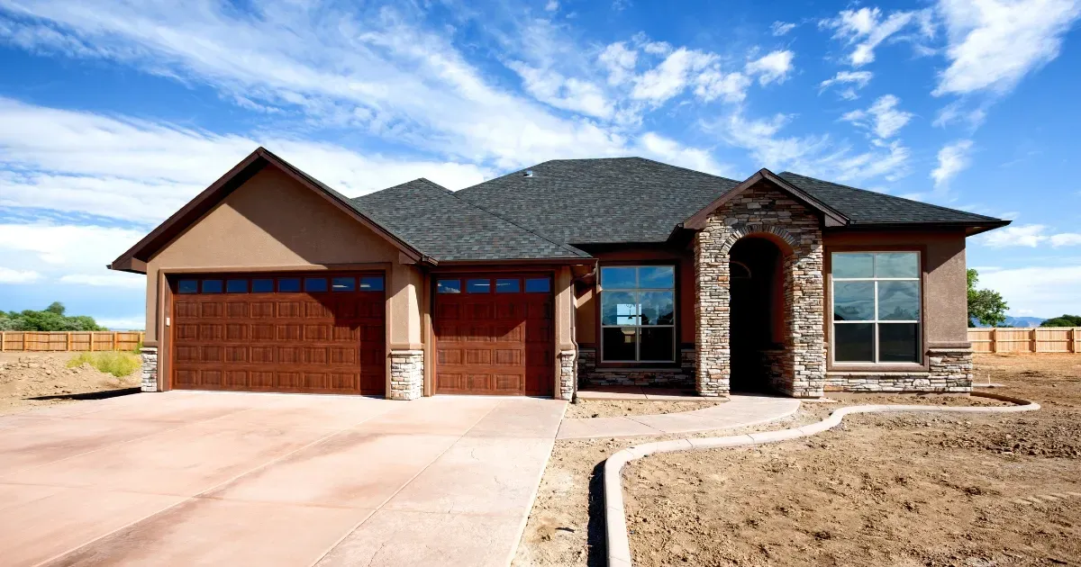 Newly built suburban single-family home with garage and driveway