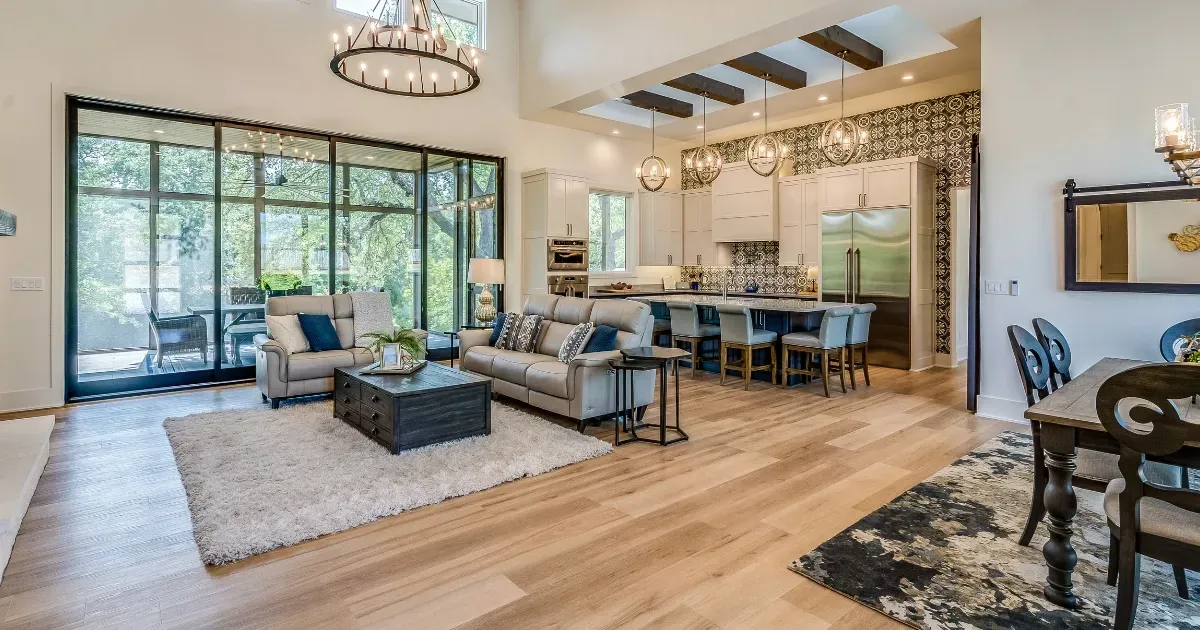 Open floor plan ideas featuring a bright living room, large glass doors, and a seamless kitchen layout
