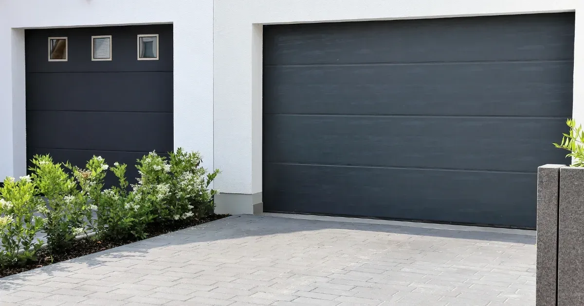 Sleek black garage door showcasing modern garage door trends in contemporary home design