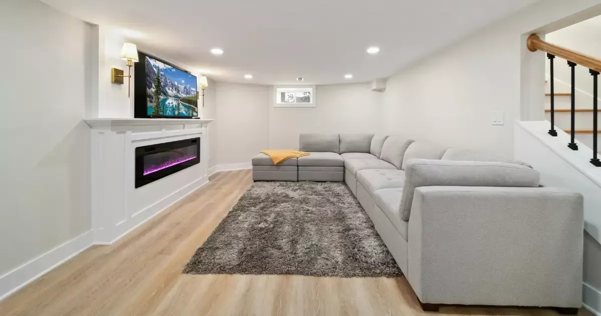 Well-lit entertainment space featuring small basement design ideas