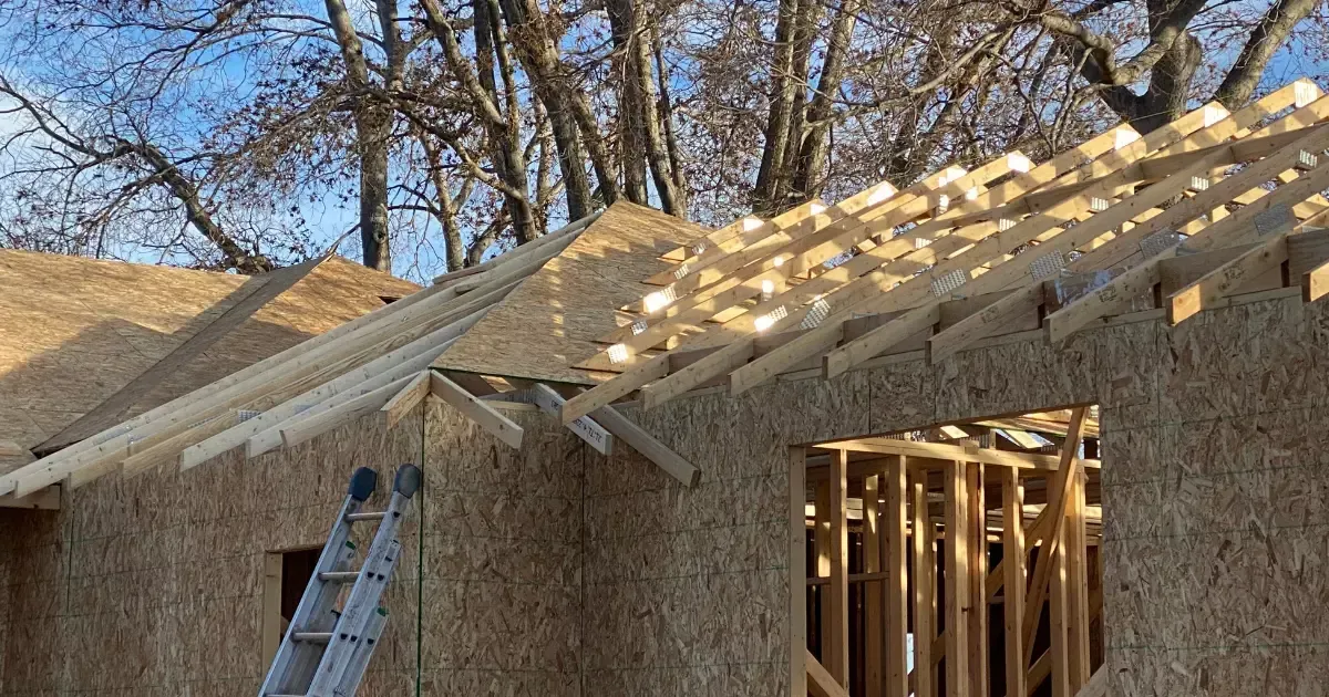 A building under construction with a ladder