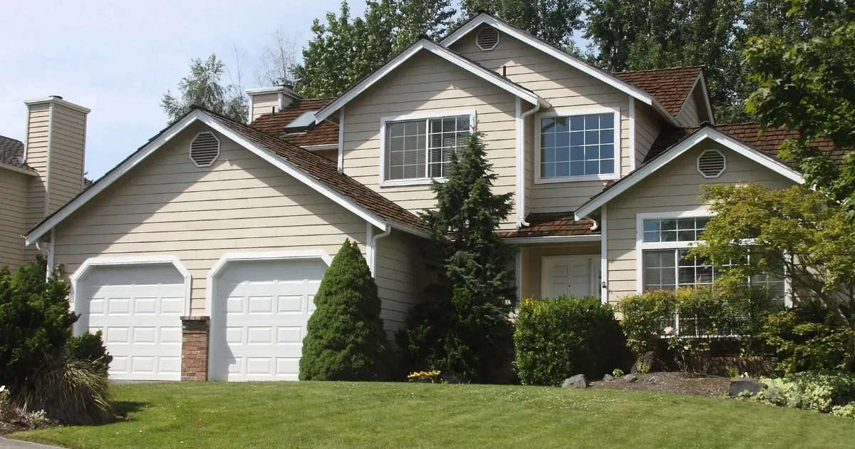 Two-story suburban home with a large garage, ideal for flexible multi-generational house plans