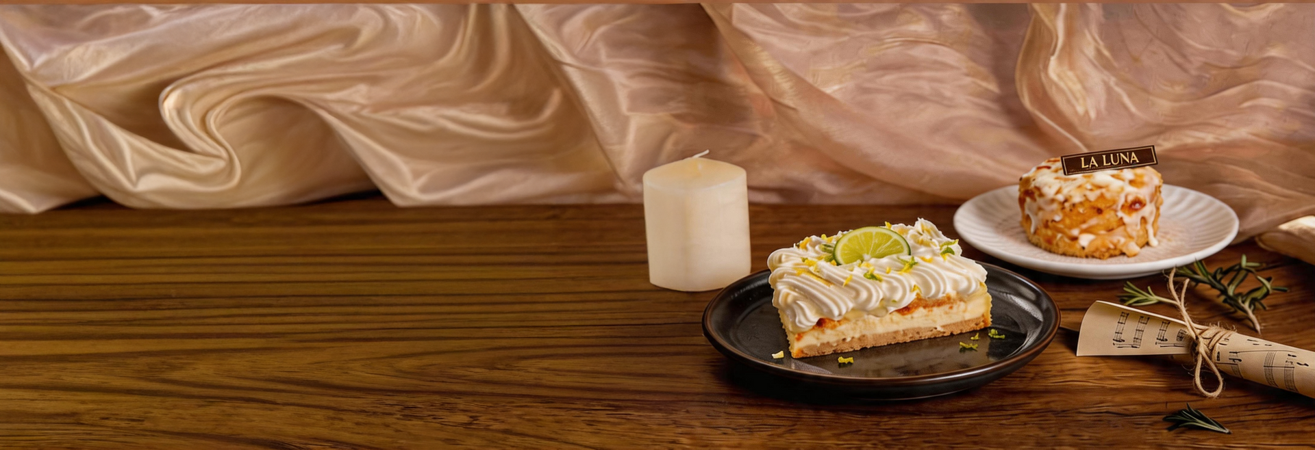Desserts on plates with a glass of milk on a wooden table against a beige backdrop