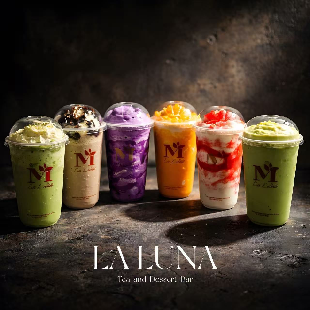 A rectangular slice of cheesecake with a cookie crust and crumb topping, garnished with a mint sprig on a patterned plate.