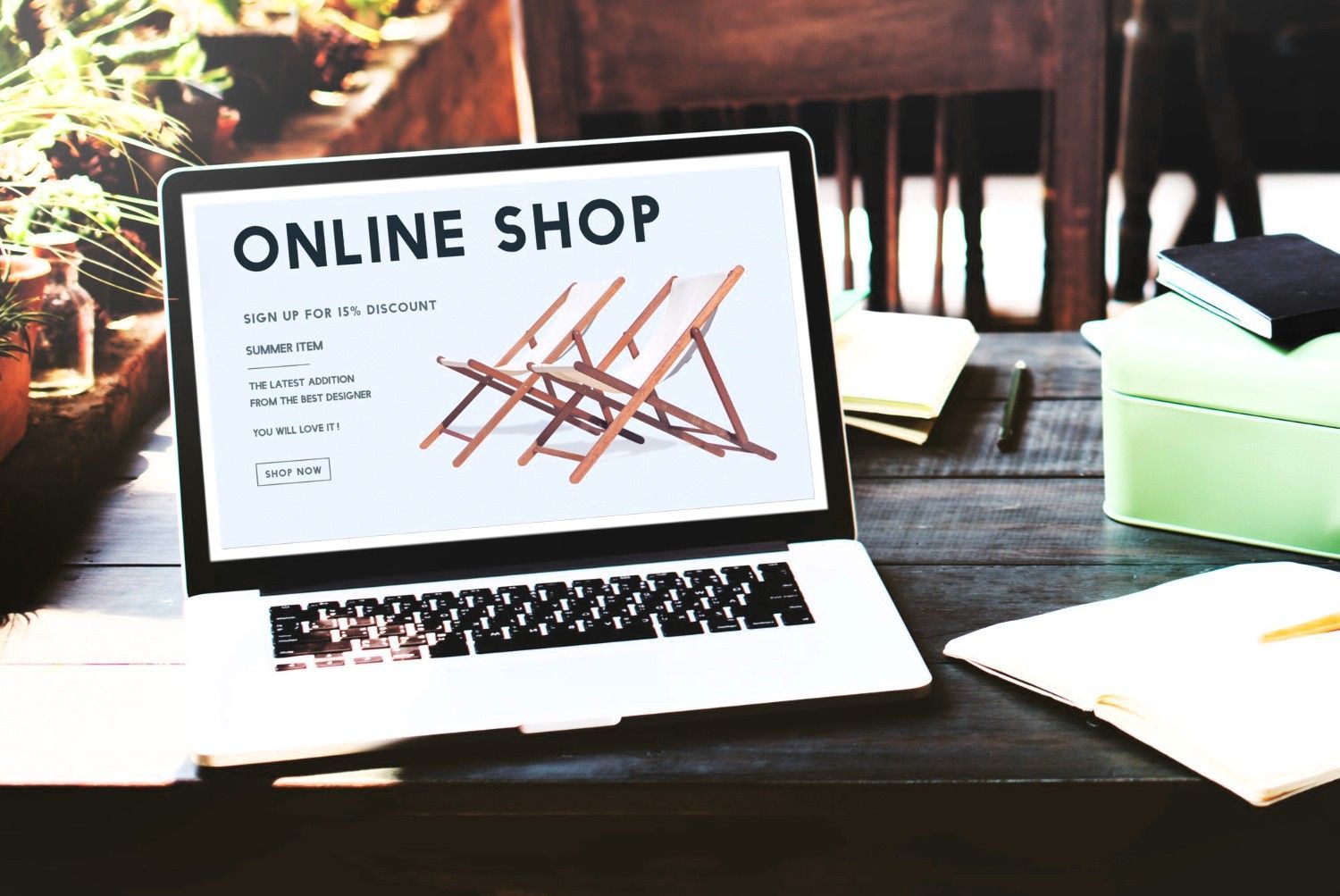A laptop computer is open to an online shop page