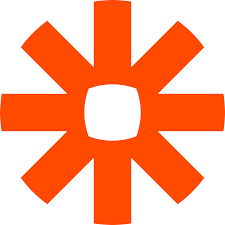 An orange star with a white center on a white background
