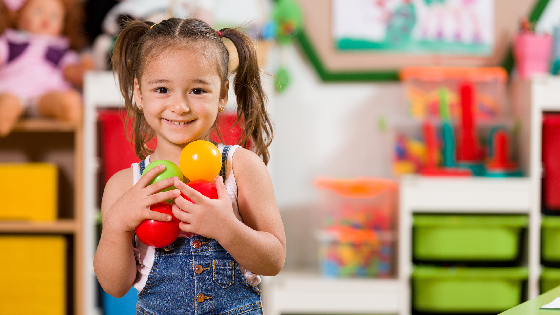 toddler holding toys