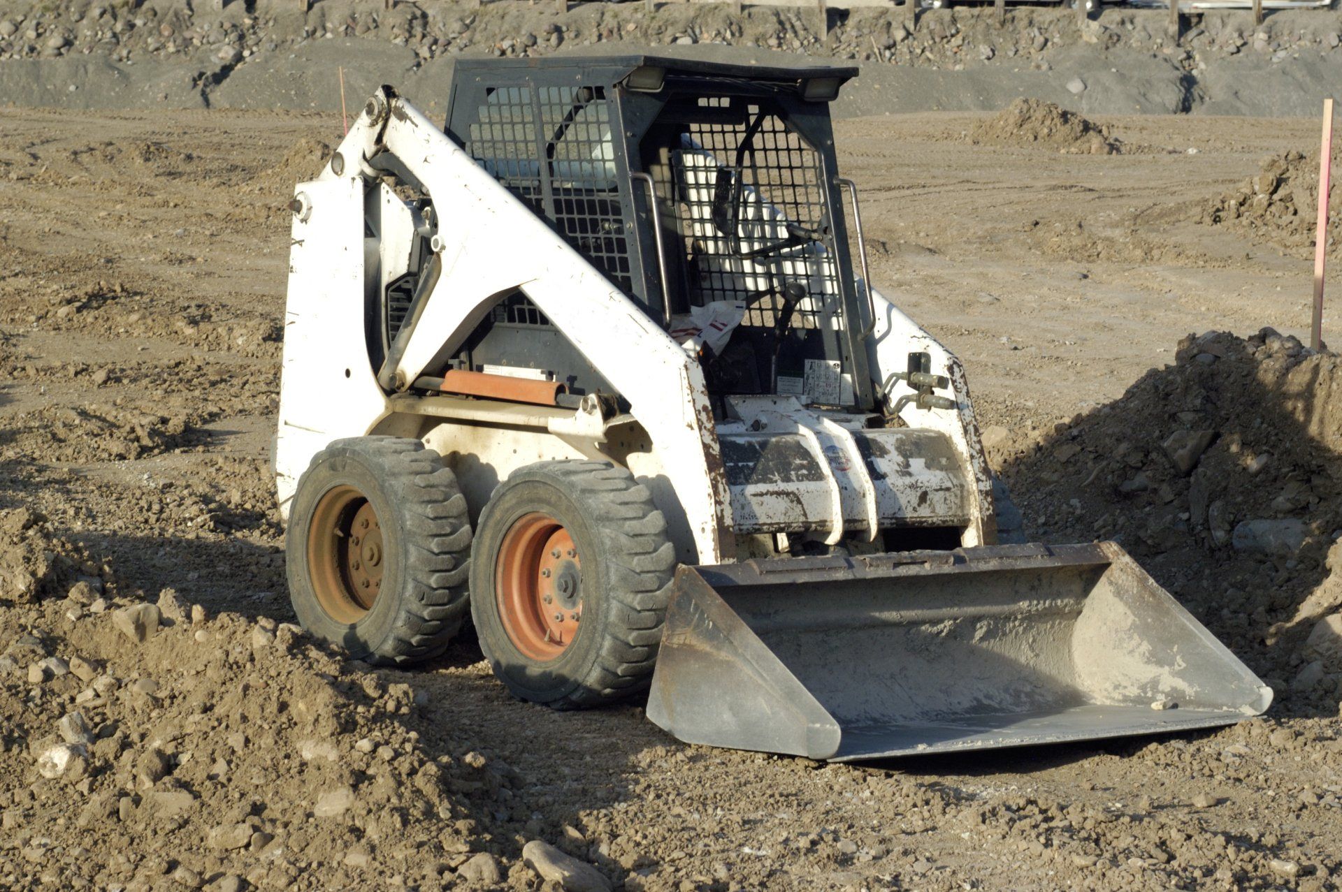 Solid Skid Steer Loader — Sunshine Coast, QLD — Sutton’s Cleaning Service