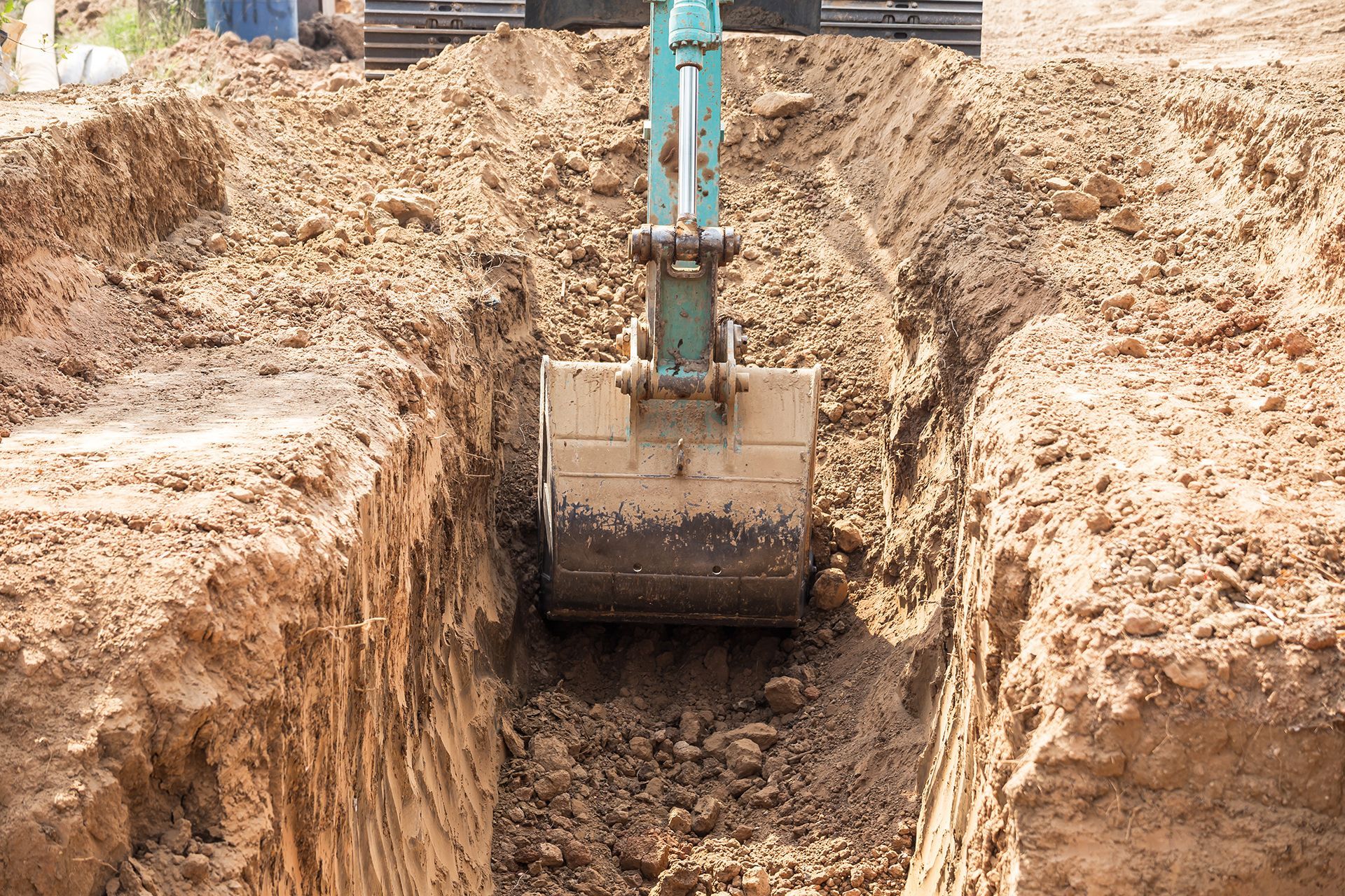 A bulldozer is digging a hole in the ground.